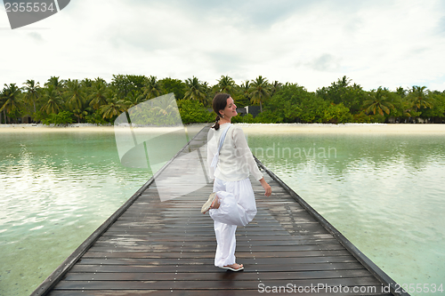 Image of young woman relax on cloudy summer day