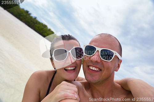 Image of happy young  couple at summer vacation have fun and relax at bea