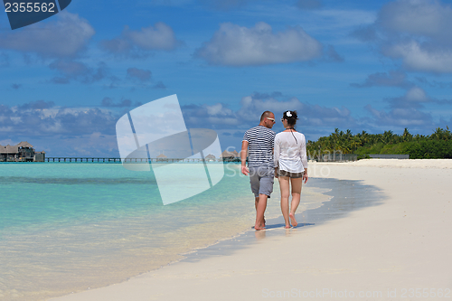 Image of happy young  couple at summer vacation have fun and relax at bea