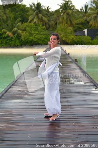 Image of young woman relax on cloudy summer day