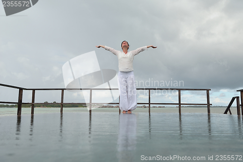 Image of young woman relax on cloudy summer day