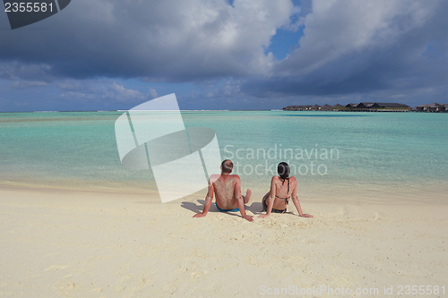 Image of happy young  couple at summer vacation have fun and relax at bea