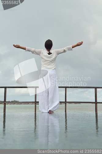 Image of young woman relax on cloudy summer day