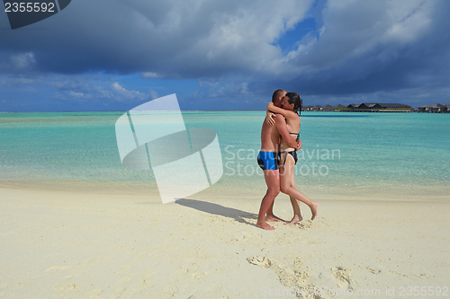 Image of happy young  couple at summer vacation have fun and relax at bea