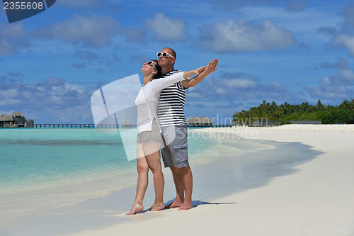 Image of happy young  couple at summer vacation have fun and relax at bea