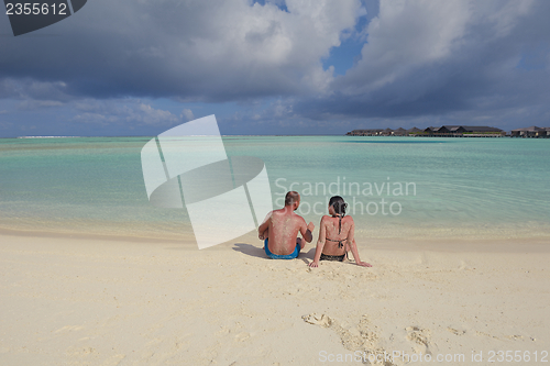 Image of happy young  couple at summer vacation have fun and relax at bea