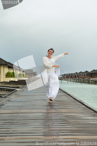 Image of young woman relax on cloudy summer day