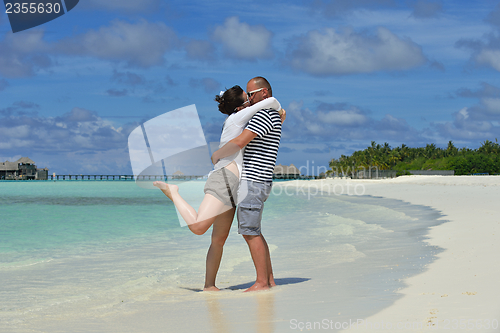 Image of happy young  couple at summer vacation have fun and relax at bea