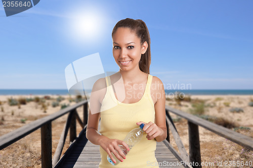 Image of Woman Holding Bottle of Water