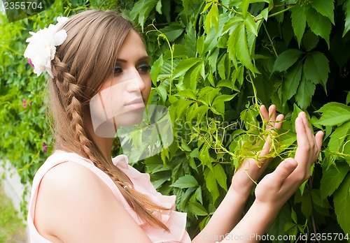 Image of Attractive woman with flower hairstyle