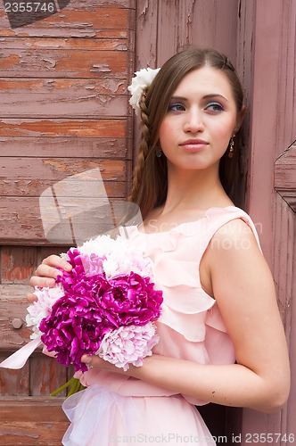 Image of beautiful woman with flower