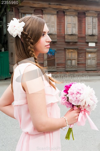 Image of beautiful woman with flower