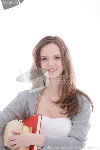 Image of Pretty young teenage student with textbooks