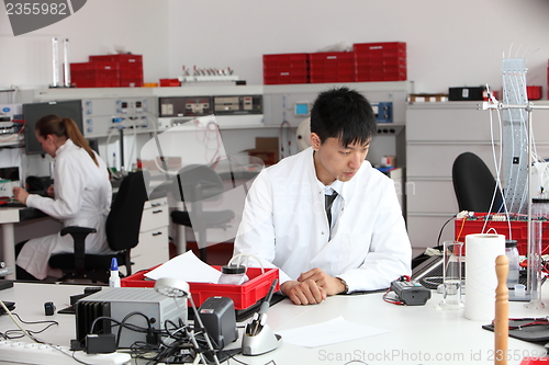 Image of Young Asian laboratory technician