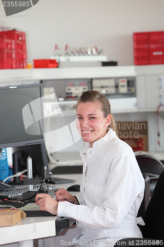 Image of Smiling confident female technician
