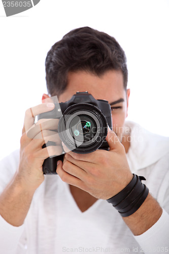 Image of Male photographer focusing on the viewer