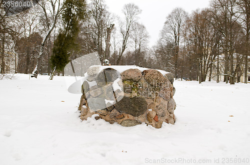 Image of ancient pagan stone altar eternal fire snow winter 