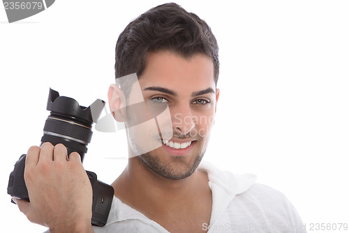 Image of Handsome man holding a dslr camera