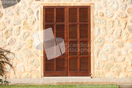 Image of Shuttered window in a stone building