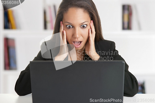 Image of Woman in Panic Looking At A Computer Monitor