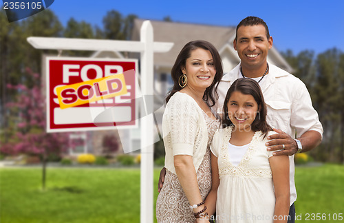 Image of Hispanic Family in Front of Their New Home and Sign