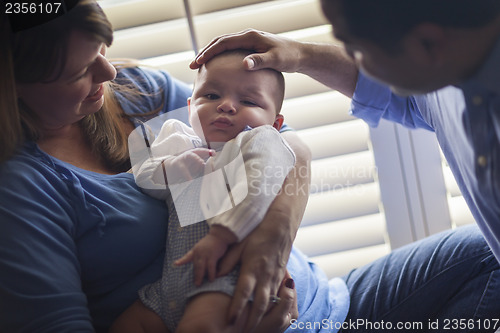 Image of Mixed Race Couple Enjoying Their Newborn Son