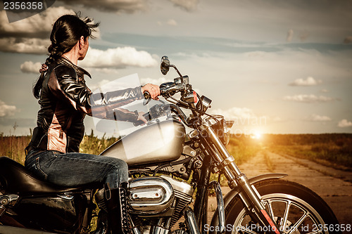 Image of Biker girl on a motorcycle