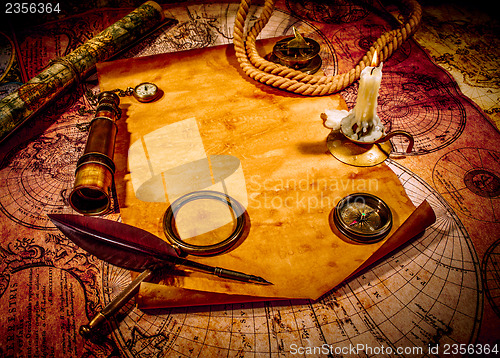 Image of Vintage still life. Vintage items on ancient map.