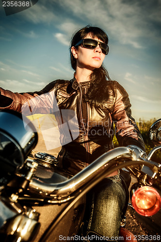 Image of Biker girl on a motorcycle