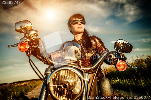 Image of Biker girl on a motorcycle