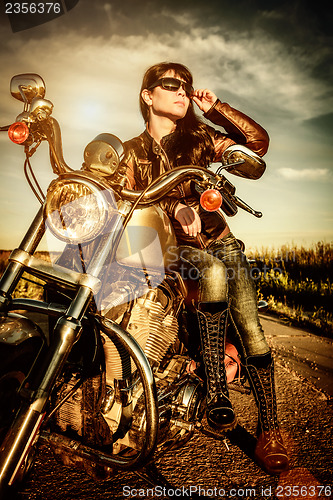 Image of Biker girl on a motorcycle