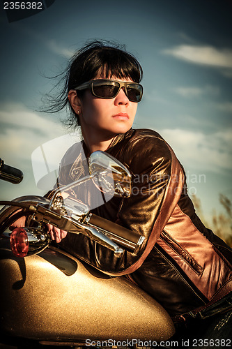 Image of Biker girl on a motorcycle