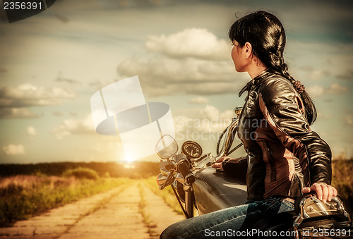 Image of Biker girl on a motorcycle