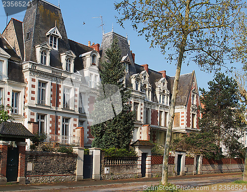 Image of Typical blue slate, white stone, red brick house, Angers, april 