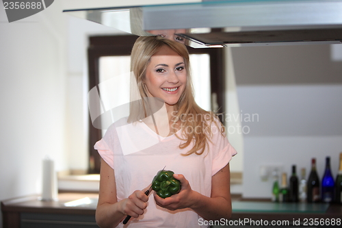 Image of Woman preparing dinner in the kitchen