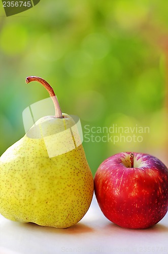 Image of Ripe pear and red apple