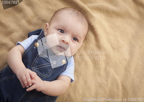 Image of Mixed Race Baby Boy Laying on Blanket