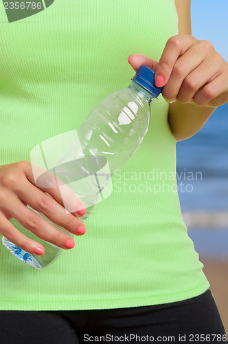 Image of Woman Holding Bottle of Water