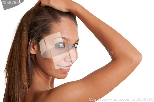 Image of Beautiful African Woman Holding Her Hair and Smiling