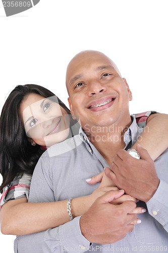 Image of Thoughtful couple hugging and looking up - isolated over white. 