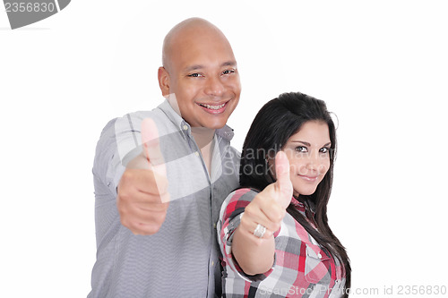 Image of Portrait of happy couple with thumbs up sign isolated on white b