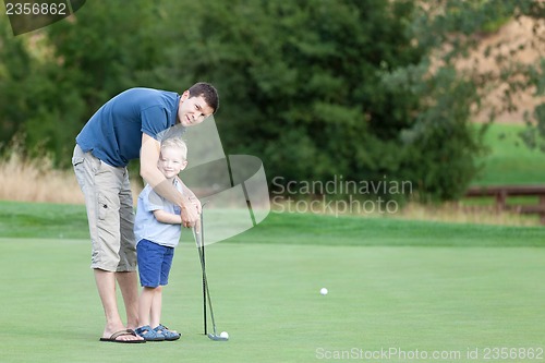 Image of family at golf course