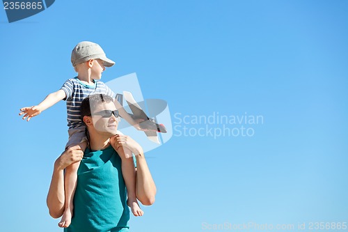 Image of family playing a toy plane