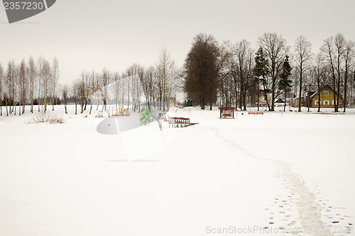Image of footpath frozen lake beach playground snow winter 