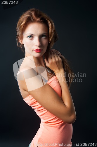 Image of young elegant woman in pink