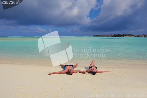 Image of happy young  couple at summer vacation have fun and relax at bea