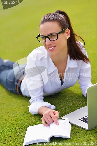 Image of woman with laptop in park