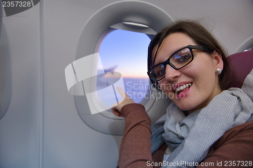 Image of woman in airplane travel