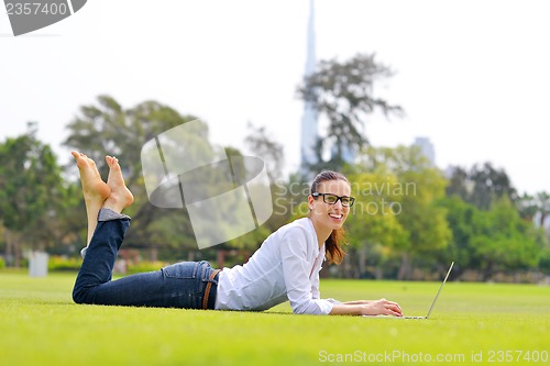 Image of woman with laptop in park