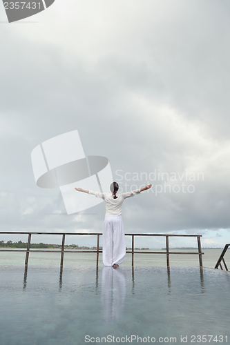 Image of young woman relax on cloudy summer day